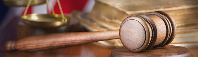 A judge's gavel resting on desk